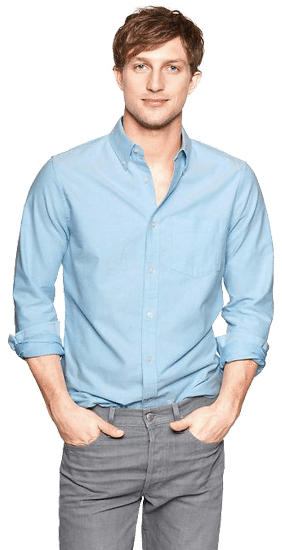 Confident young man in light blue shirt and grey trousers standing with hands in pockets