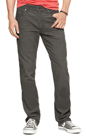 Man wearing gray jeans with red shirt and white sneakers.