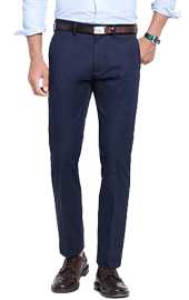 Man modeling navy blue chinos with brown belt and dress shoes without head visible